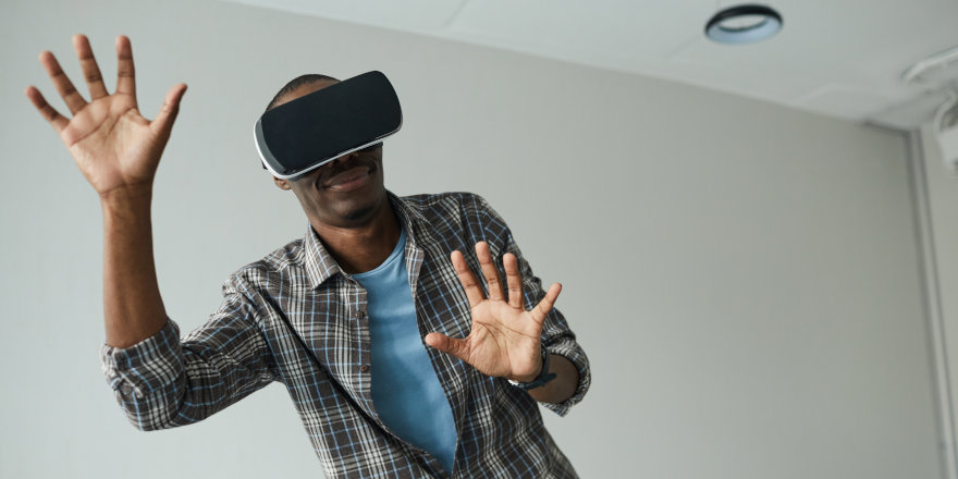 A man plays a video game in virtual reality developed at Middlesex University!